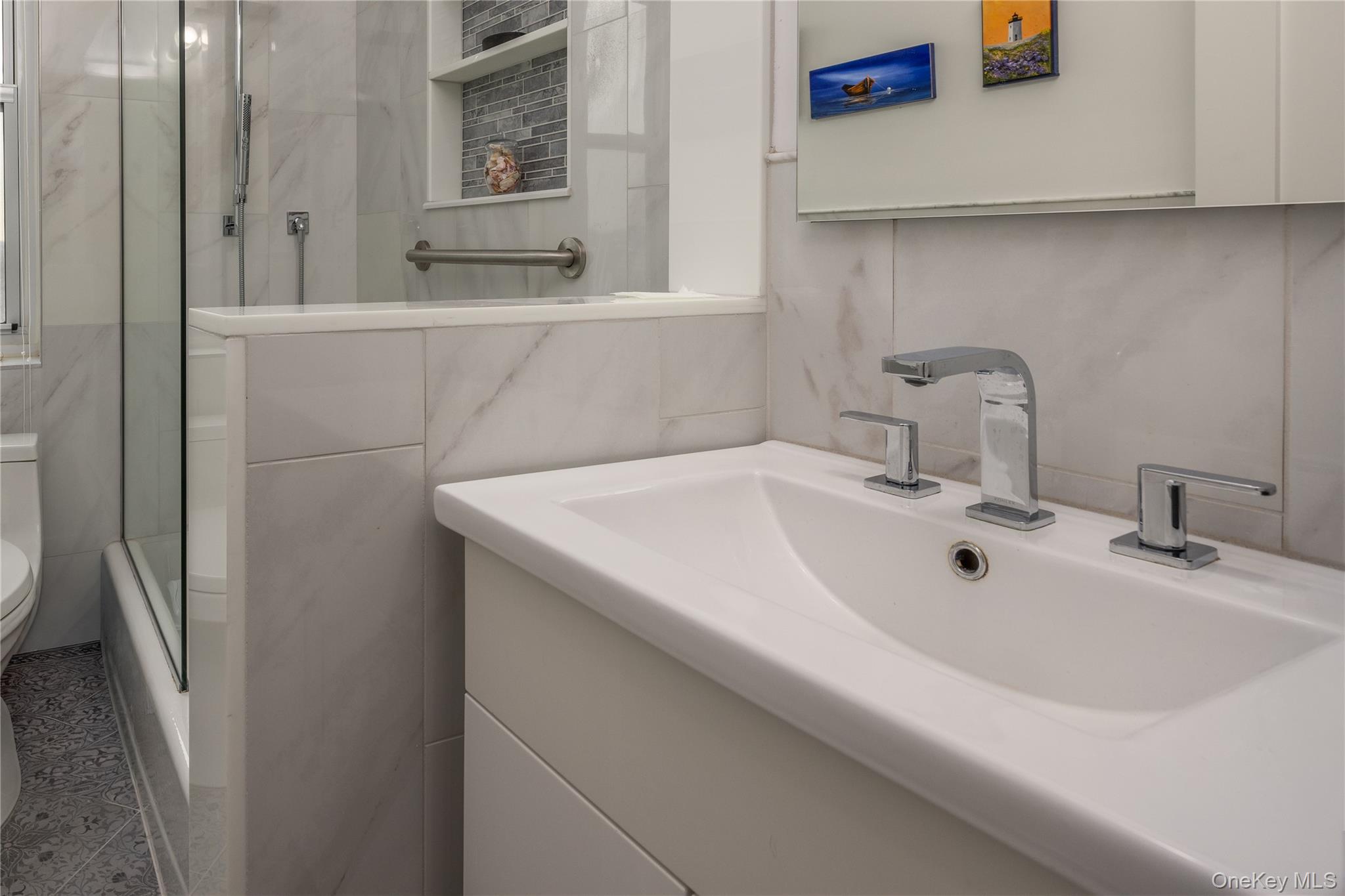 900 Palmer Road, Unit 9J Bronxville, NY 10708 - Photo 9 of 14 a bathroom with a sink and a mirror