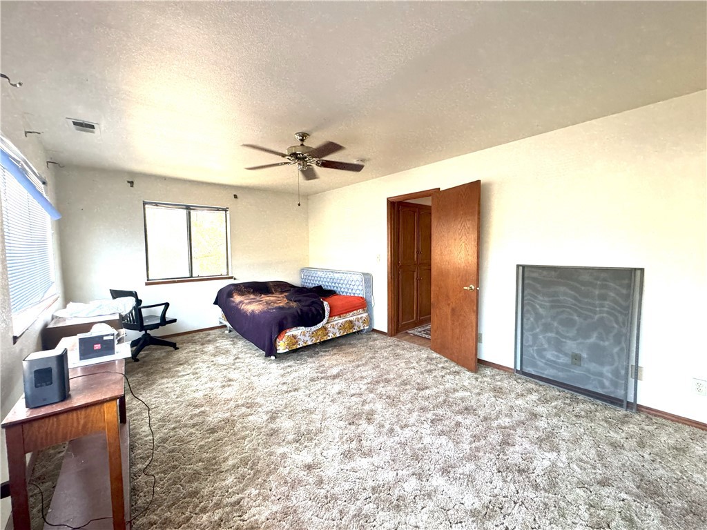 18720 Wingfoot Place Tehachapi, CA 93561 - Photo 19 of 26 a living room with furniture a window and a flat screen tv