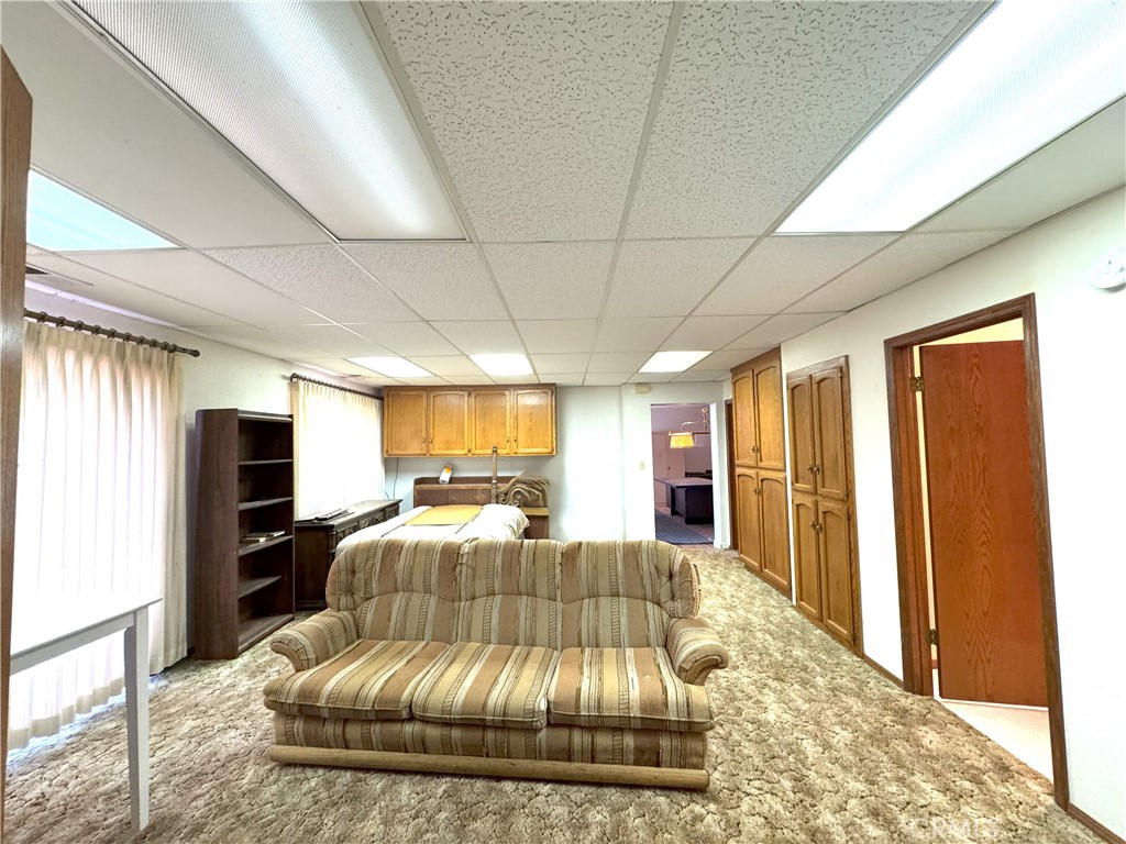 18720 Wingfoot Place Tehachapi, CA 93561 - Photo 8 of 26 a bedroom with a large bed and a couch