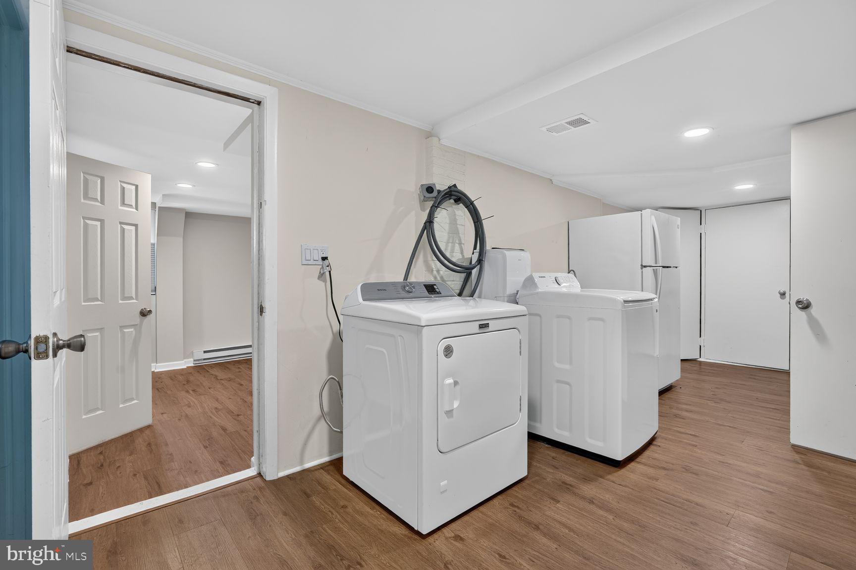 3919 Chesterbrook Road Arlington, VA 22207 - Photo 20 of 26 a view of a storage & utility room with closet wooden floor