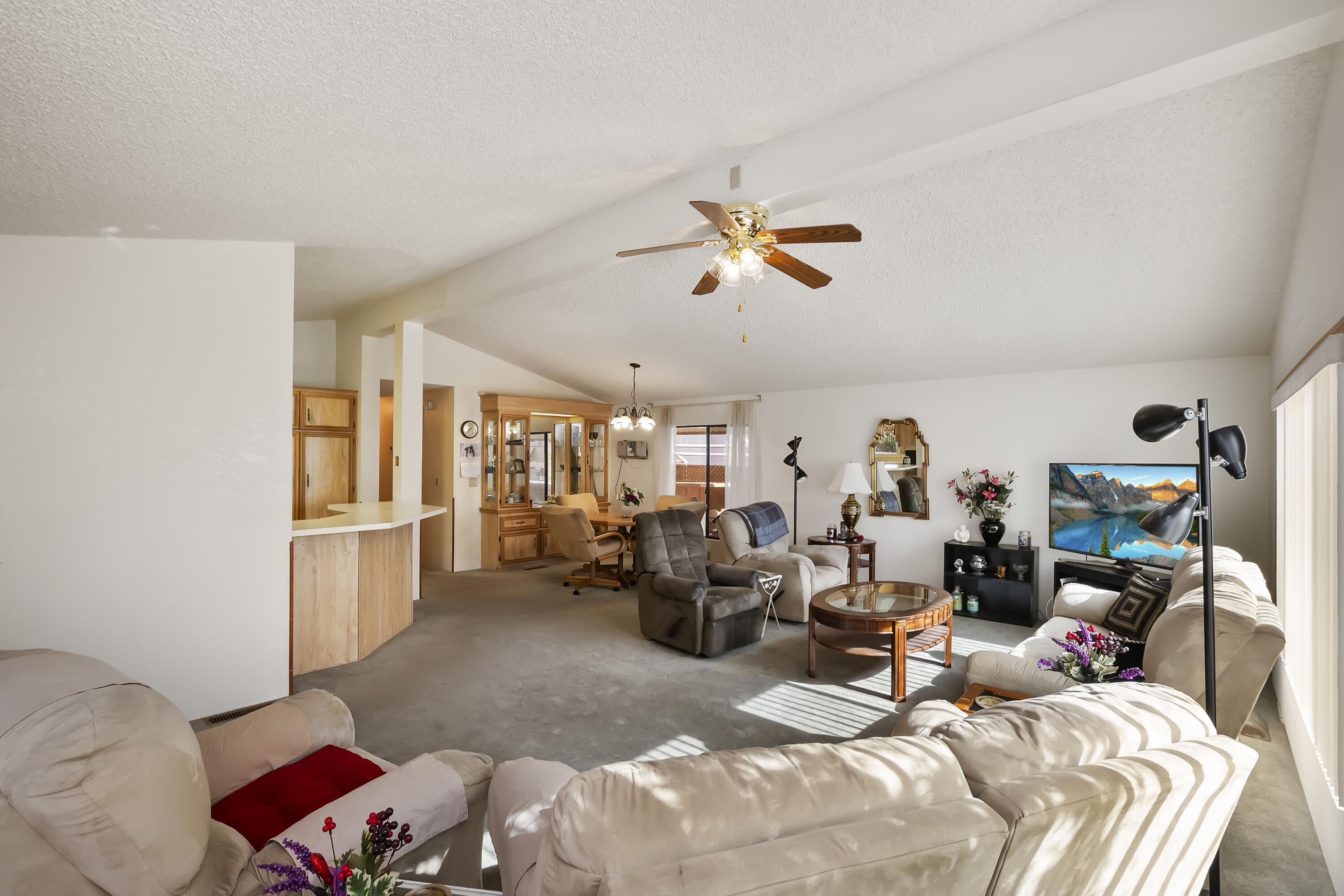 74711 Dillon Road, Unit 585 Desert Hot Springs, CA 92241 - Photo 15 of 60 a bed room with a bed furniture and a window