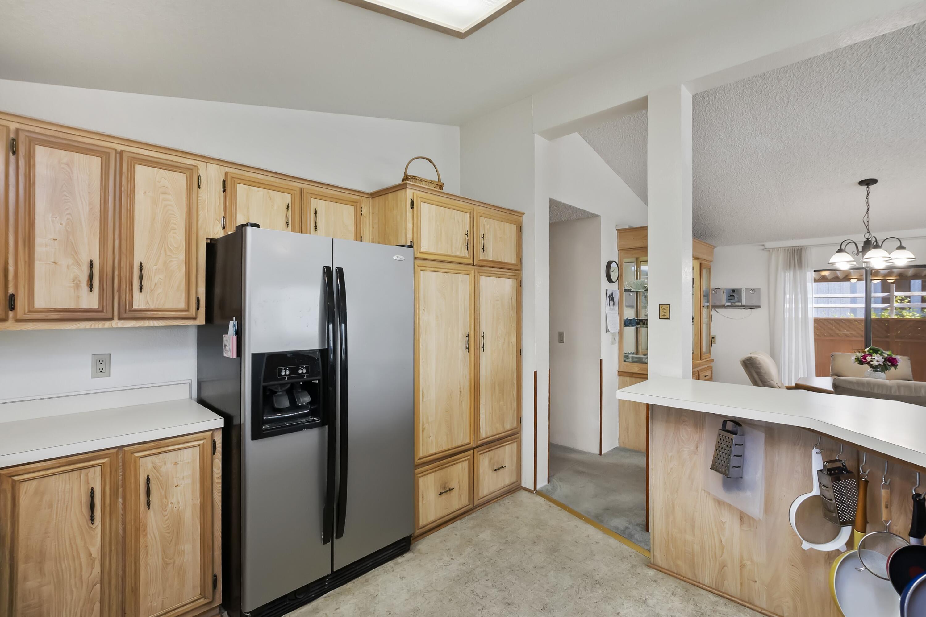 74711 Dillon Road, Unit 585 Desert Hot Springs, CA 92241 - Photo 26 of 60 a kitchen with stainless steel appliances a refrigerator and a stove