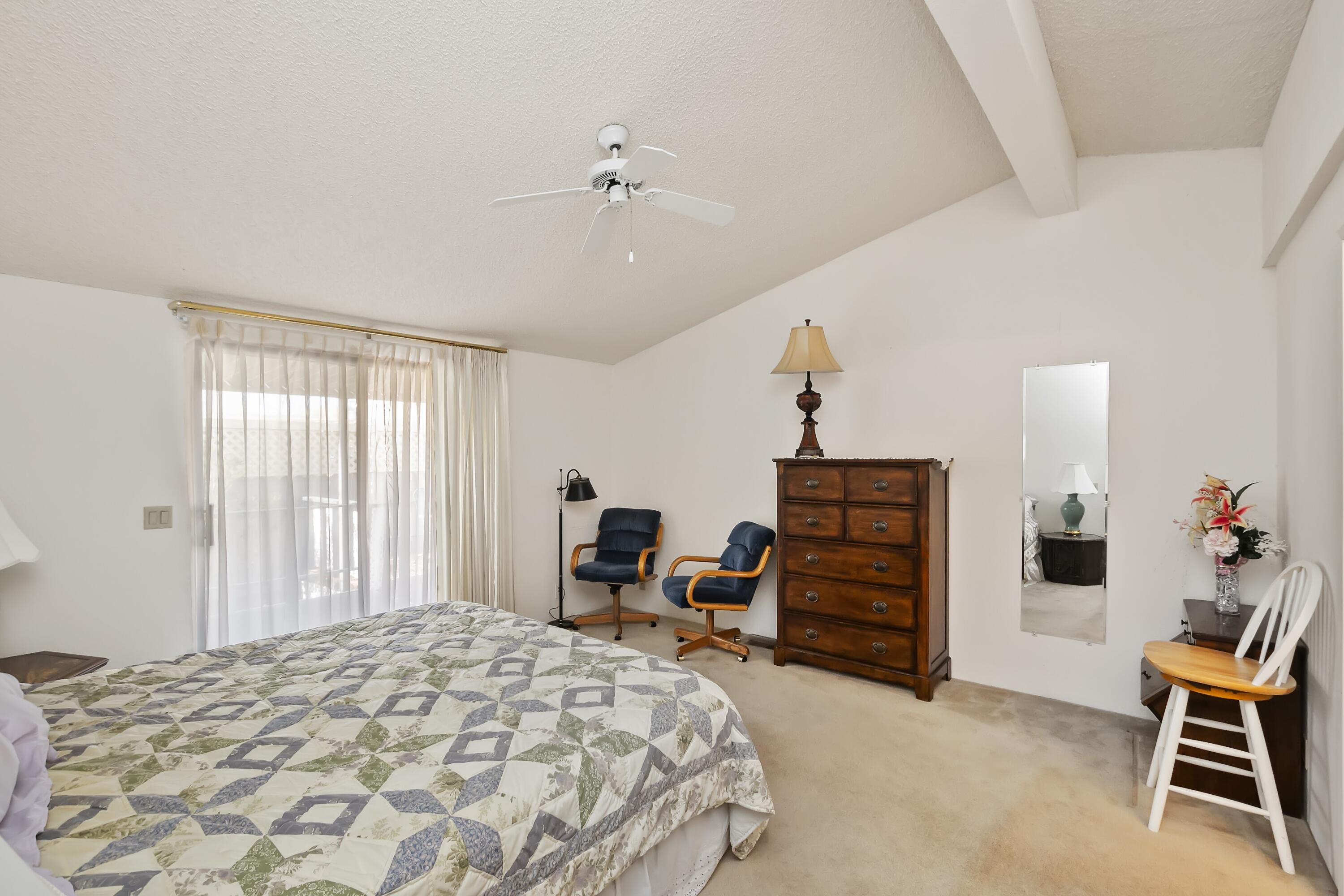 74711 Dillon Road, Unit 585 Desert Hot Springs, CA 92241 - Photo 27 of 60 a bed room with a bed and a chair