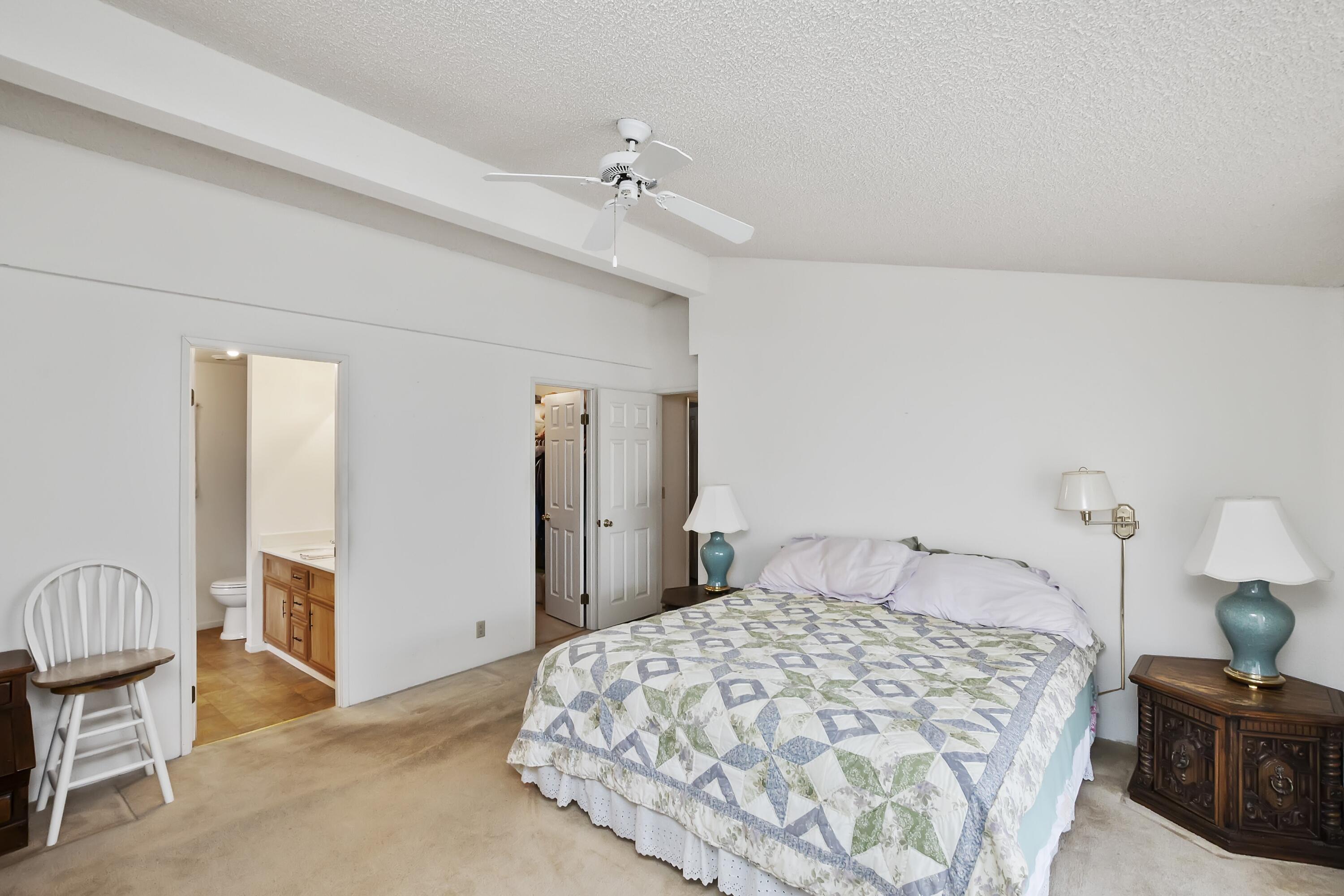 74711 Dillon Road, Unit 585 Desert Hot Springs, CA 92241 - Photo 29 of 60 a bedroom with a bed and cabinets