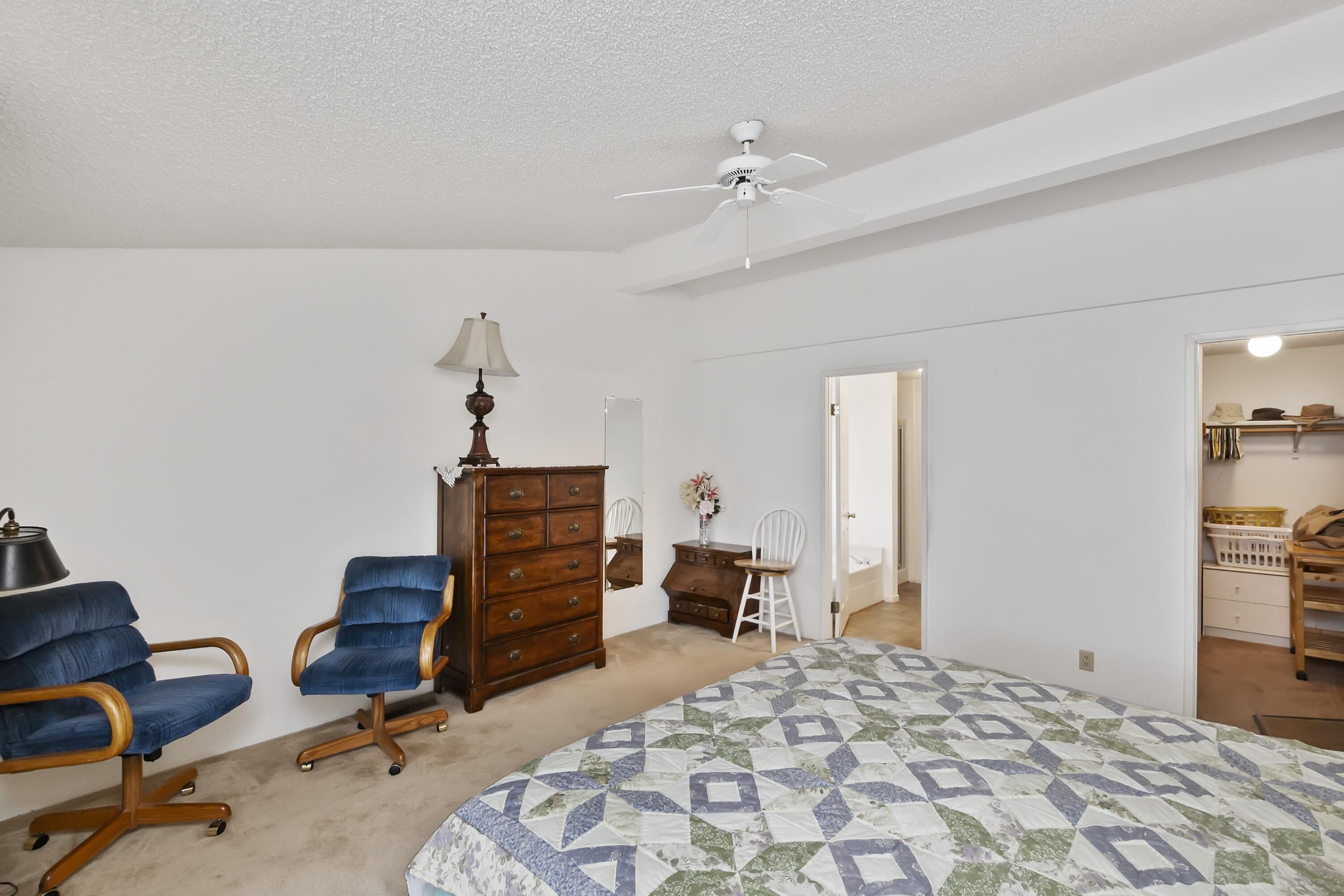 74711 Dillon Road, Unit 585 Desert Hot Springs, CA 92241 - Photo 30 of 60 a bedroom with a bed and cabinets