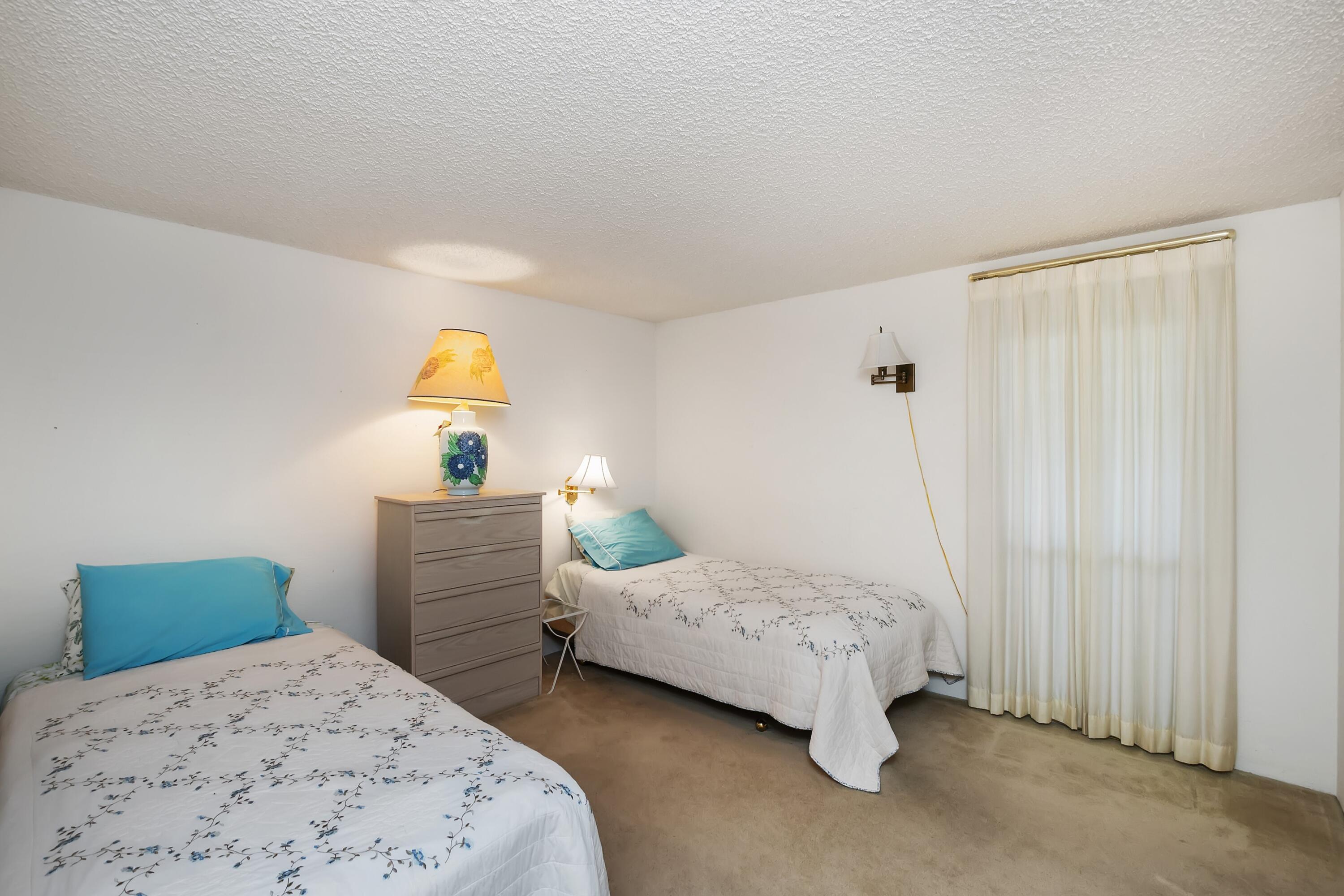 74711 Dillon Road, Unit 585 Desert Hot Springs, CA 92241 - Photo 33 of 60 a bedroom with a bed and a window