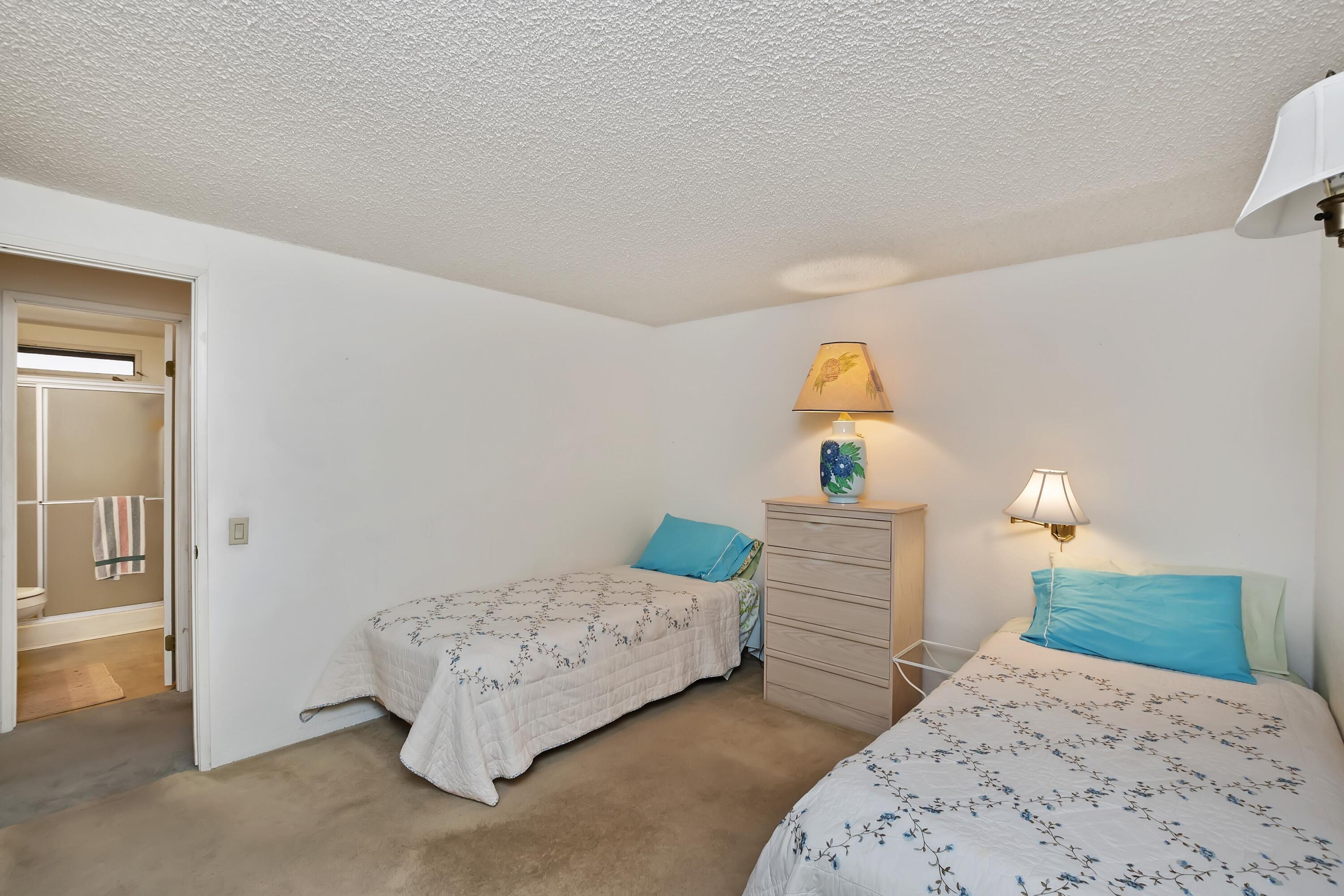 74711 Dillon Road, Unit 585 Desert Hot Springs, CA 92241 - Photo 34 of 60 a bedroom with a bed and a cabinets