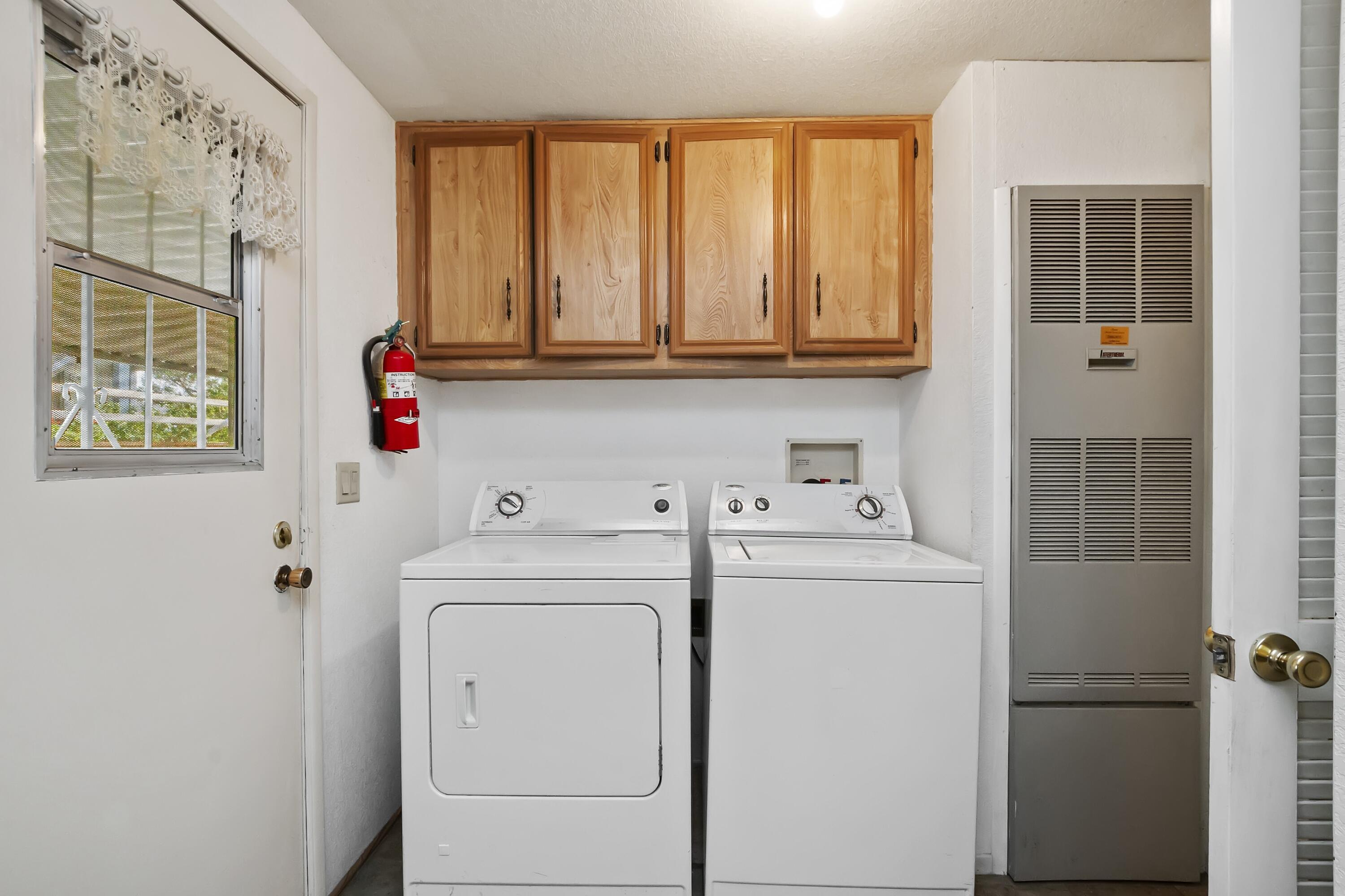 74711 Dillon Road, Unit 585 Desert Hot Springs, CA 92241 - Photo 36 of 60 a utility room with dryer and washer