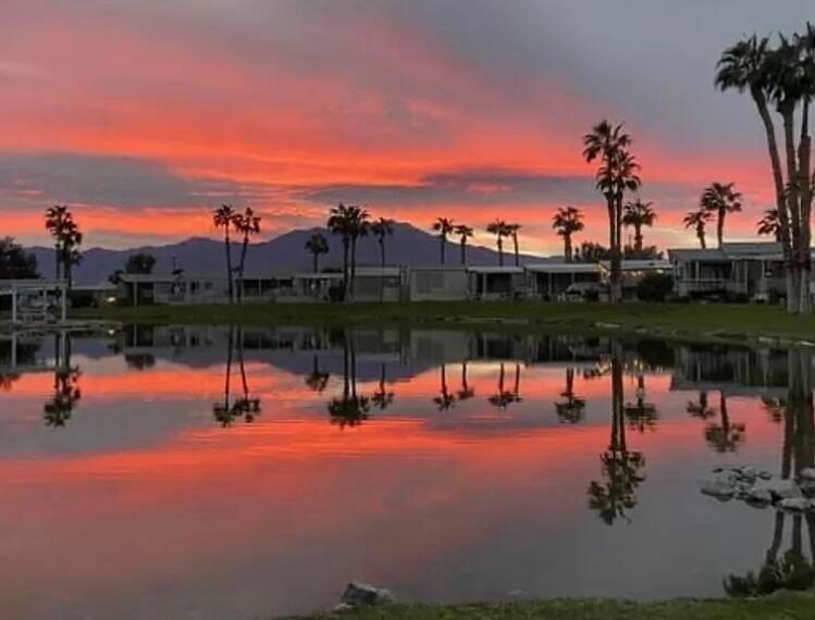 74711 Dillon Road, Unit 585 Desert Hot Springs, CA 92241 - Photo 59 of 60 a view of a lake with a yard and mountain view