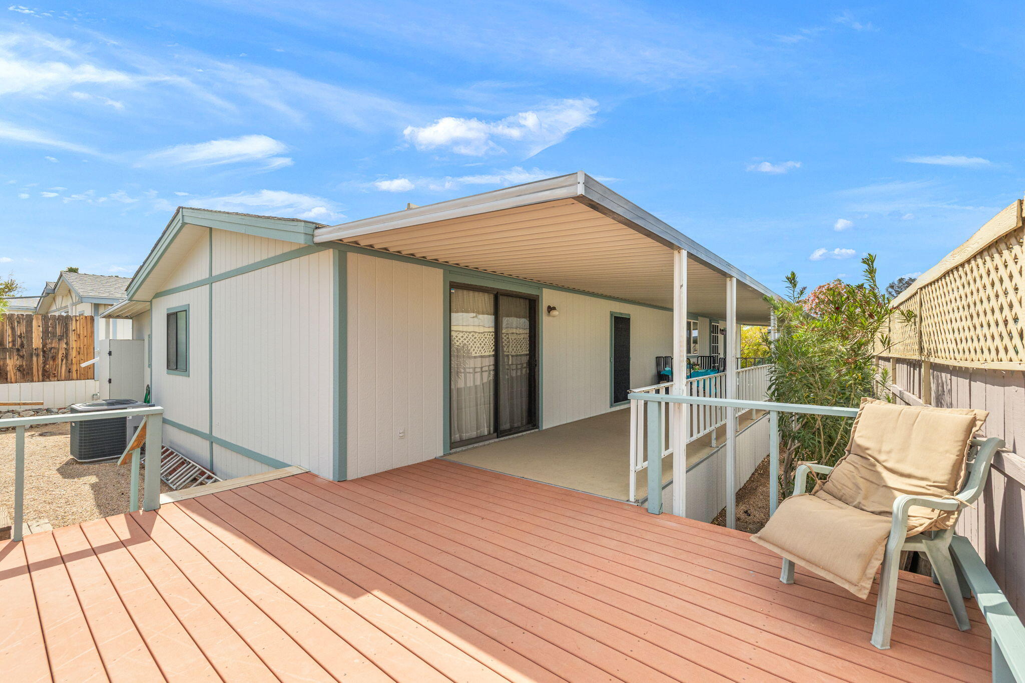 74711 Dillon Road, Unit 585 Desert Hot Springs, CA 92241 - Photo 7 of 60 a front view of a house with wooden floor and seating space