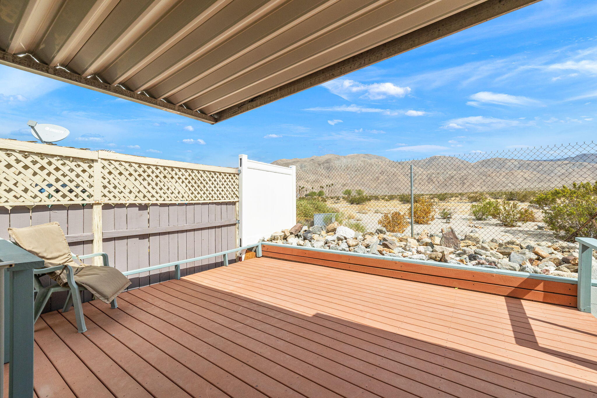 74711 Dillon Road, Unit 585 Desert Hot Springs, CA 92241 - Photo 9 of 60 a view of a balcony with an outdoor space