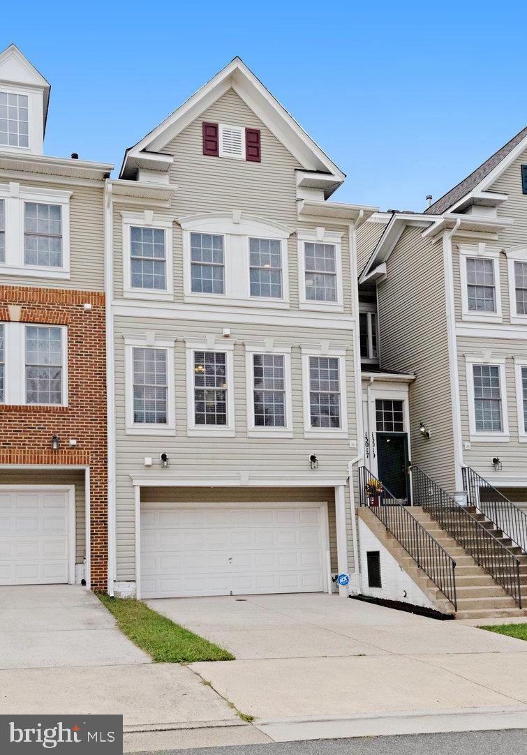 13017 Bath Gate Way Bristow, VA 20136 - Photo 1 of 35 a front view of a house with a garage
