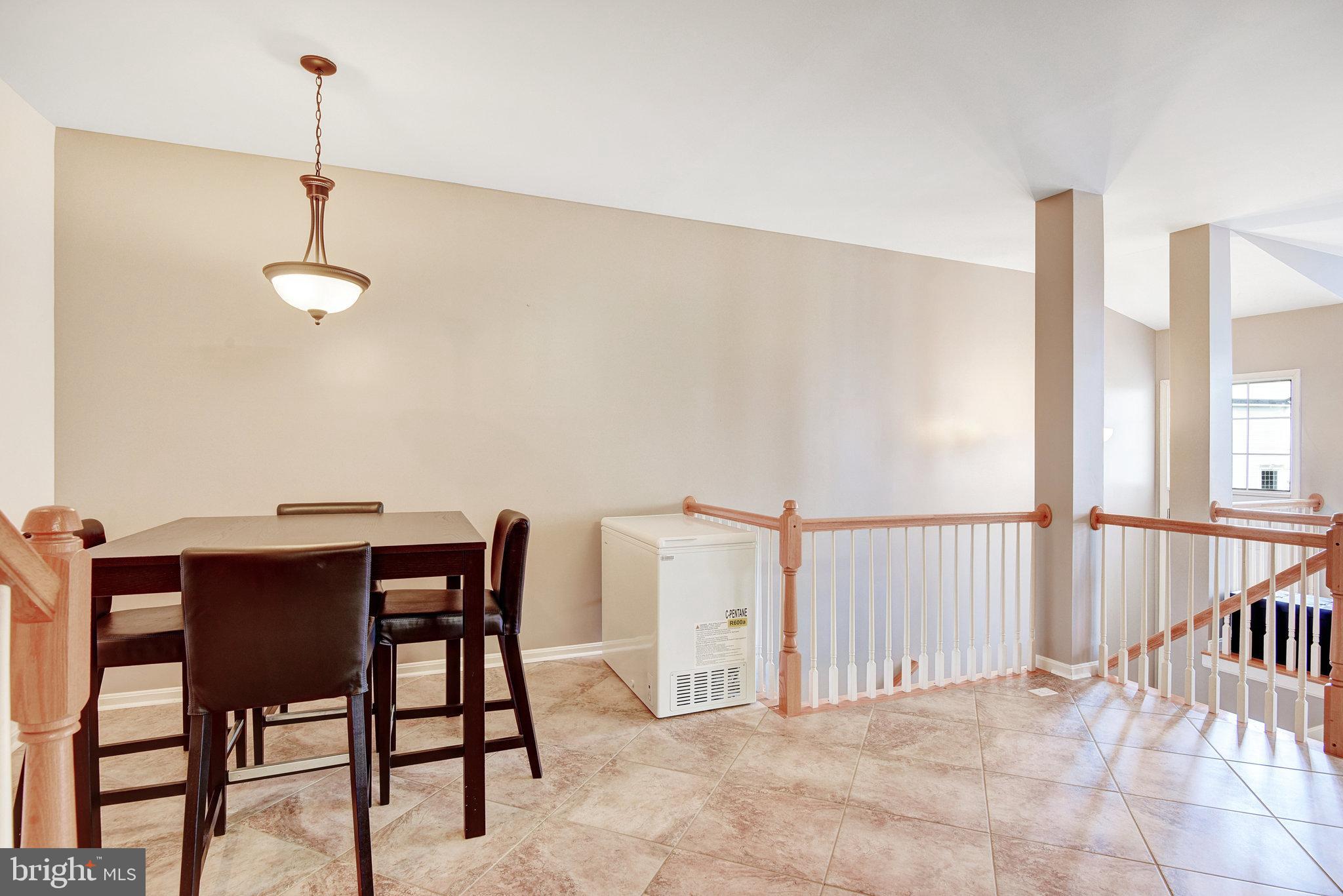 13017 Bath Gate Way Bristow, VA 20136 - Photo 12 of 35 a view of a dining room with furniture