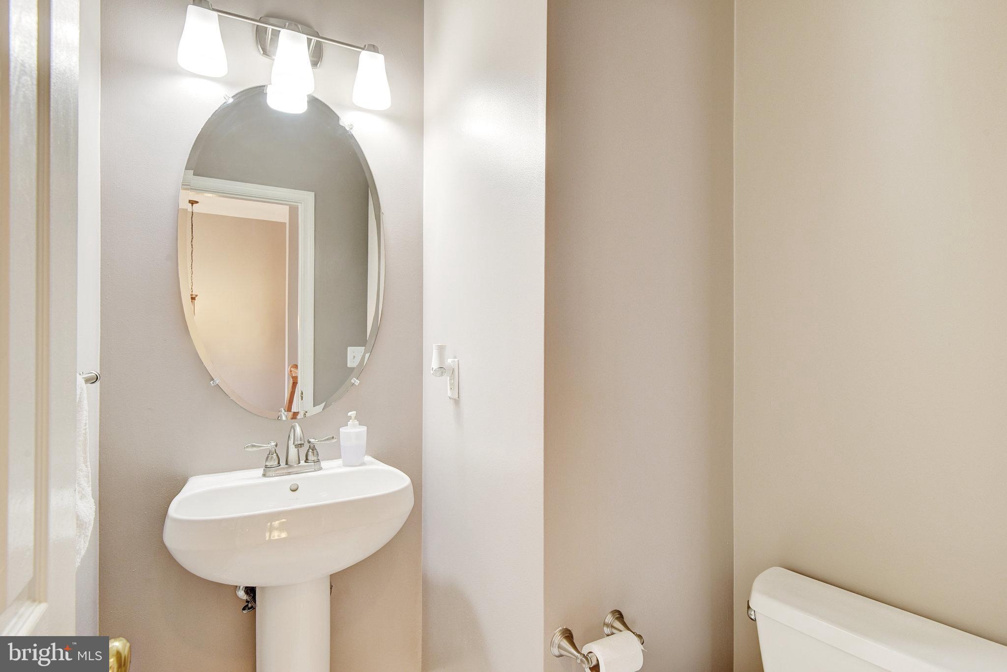 13017 Bath Gate Way Bristow, VA 20136 - Photo 16 of 35 a bathroom with a sink and a mirror