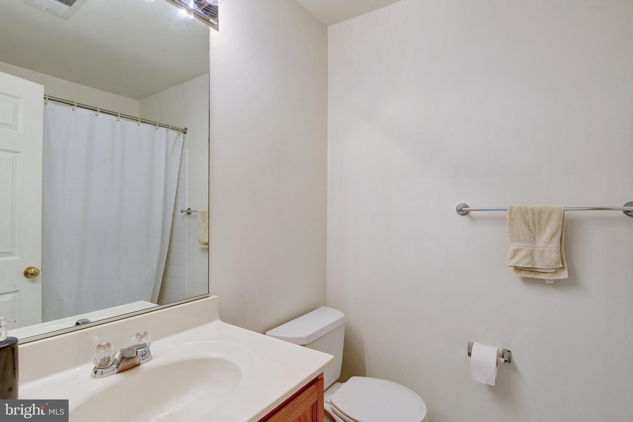 13017 Bath Gate Way Bristow, VA 20136 - Photo 25 of 35 a bathroom with a sink toilet and mirror