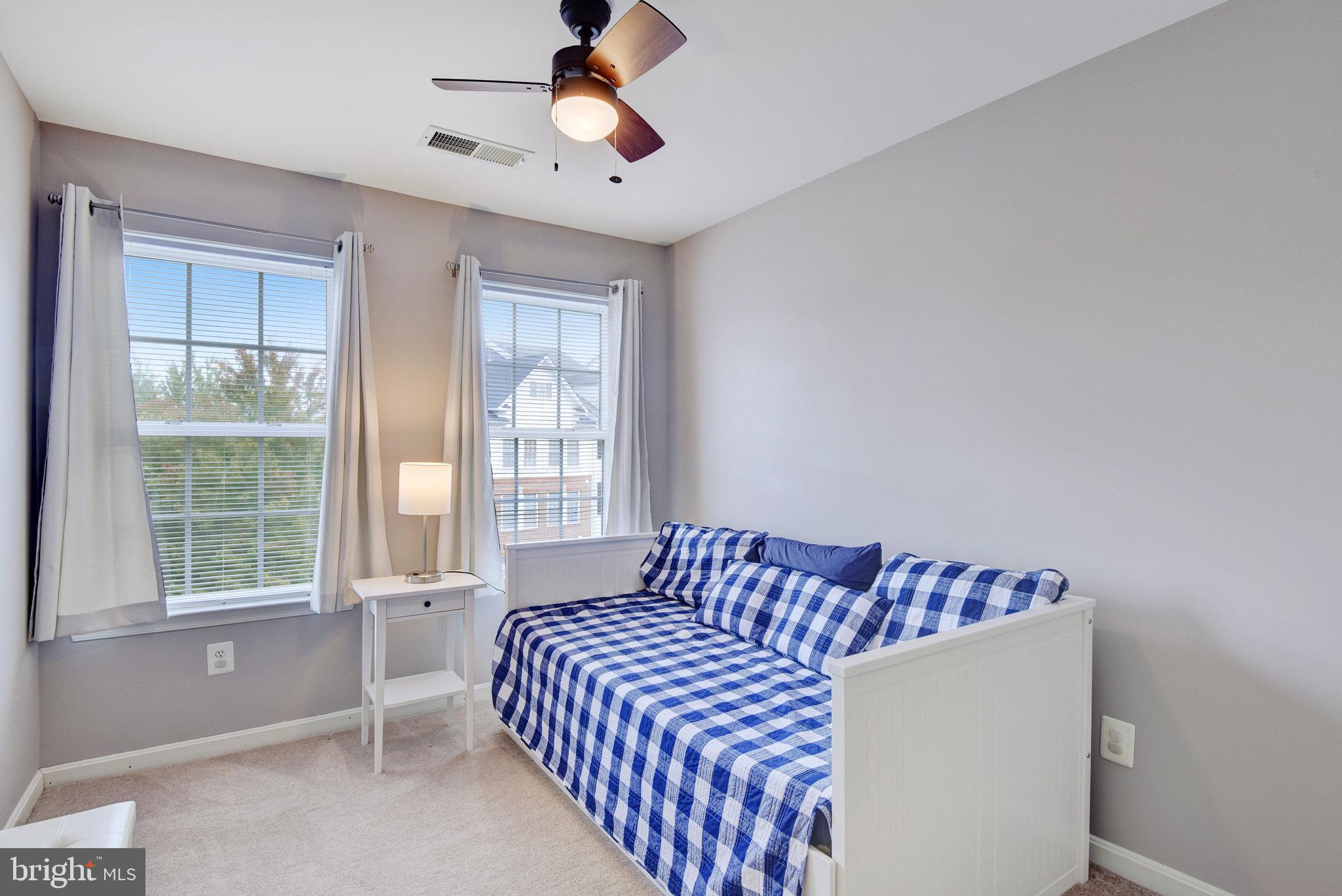 13017 Bath Gate Way Bristow, VA 20136 - Photo 27 of 35 a bedroom with a bed and a window