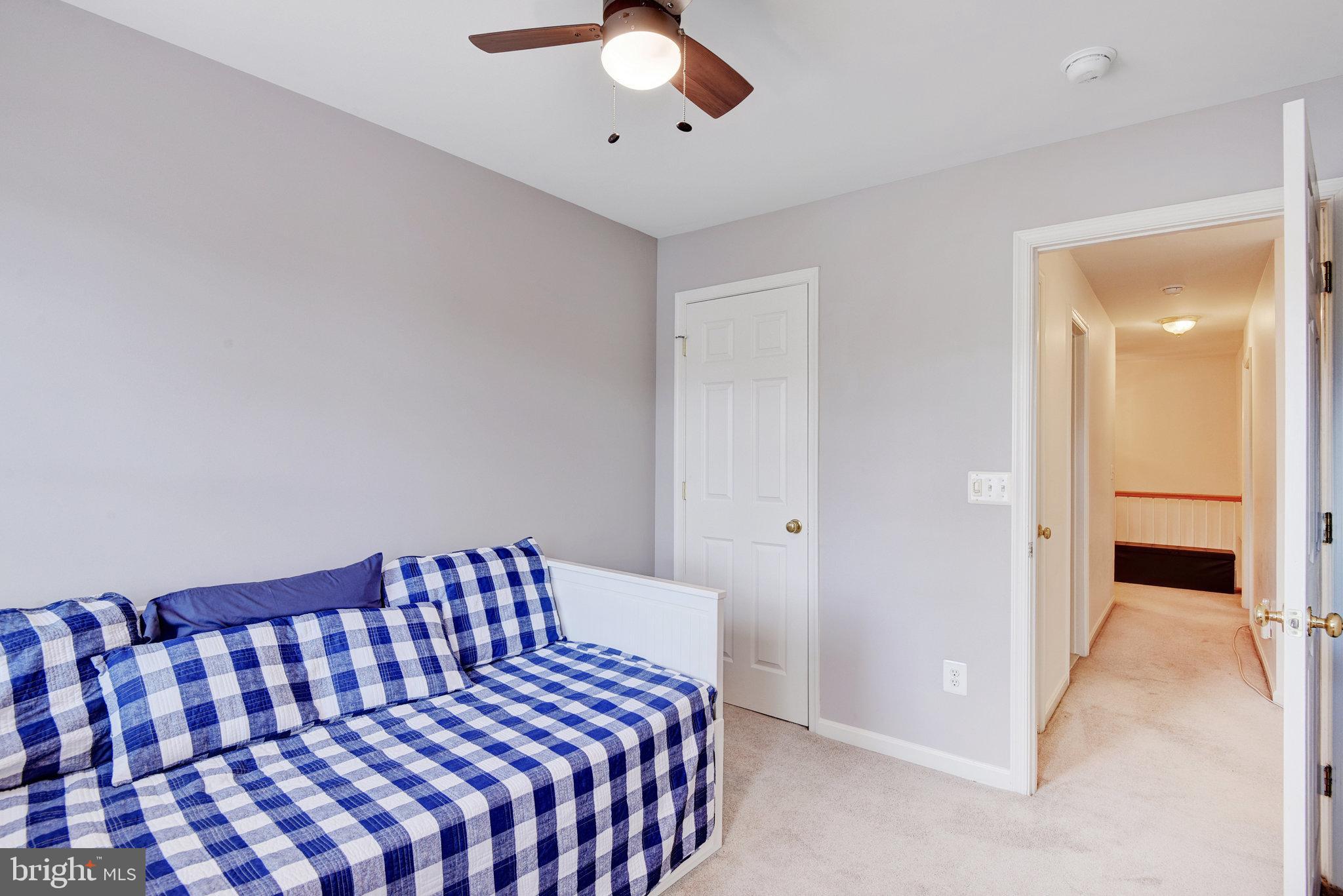 13017 Bath Gate Way Bristow, VA 20136 - Photo 28 of 35 a bedroom with a bed and a chandelier