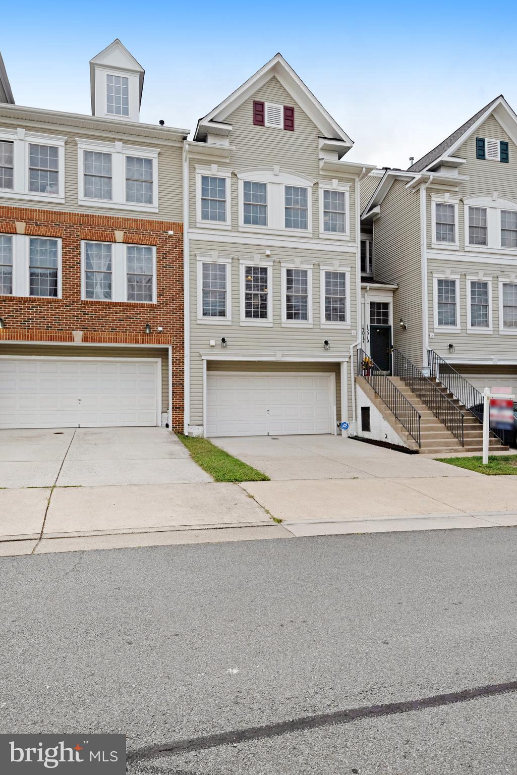 13017 Bath Gate Way Bristow, VA 20136 - Photo 3 of 35 a front view of residential houses with yard