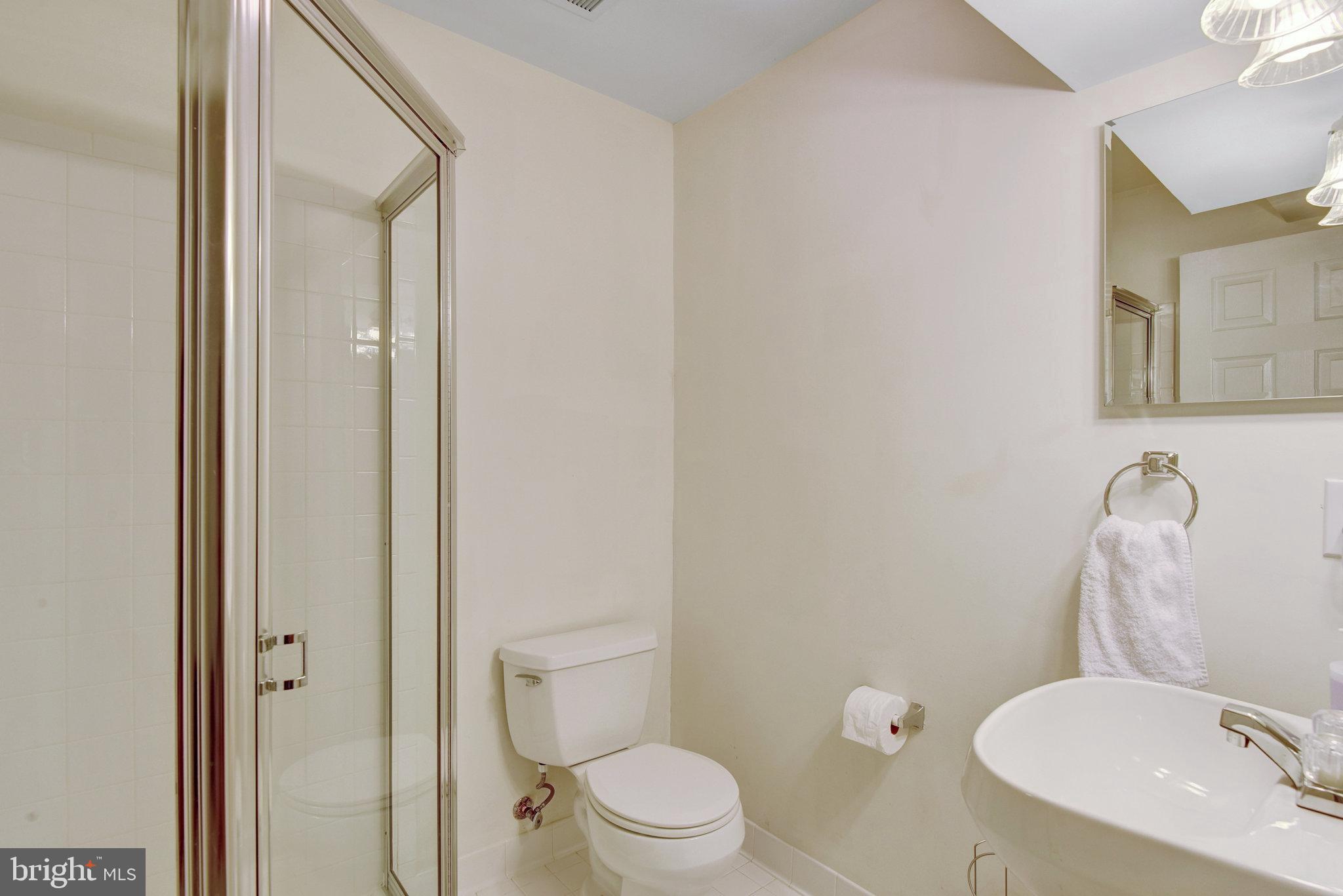 13017 Bath Gate Way Bristow, VA 20136 - Photo 34 of 35 a white toilet sitting next to a bathroom sink