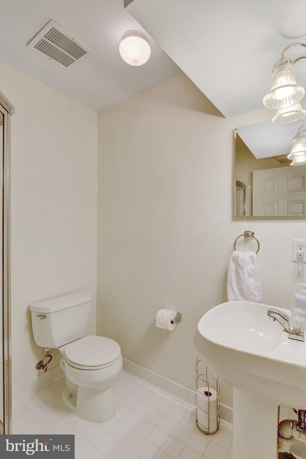 13017 Bath Gate Way Bristow, VA 20136 - Photo 35 of 35 a white toilet sitting next to a bathroom sink