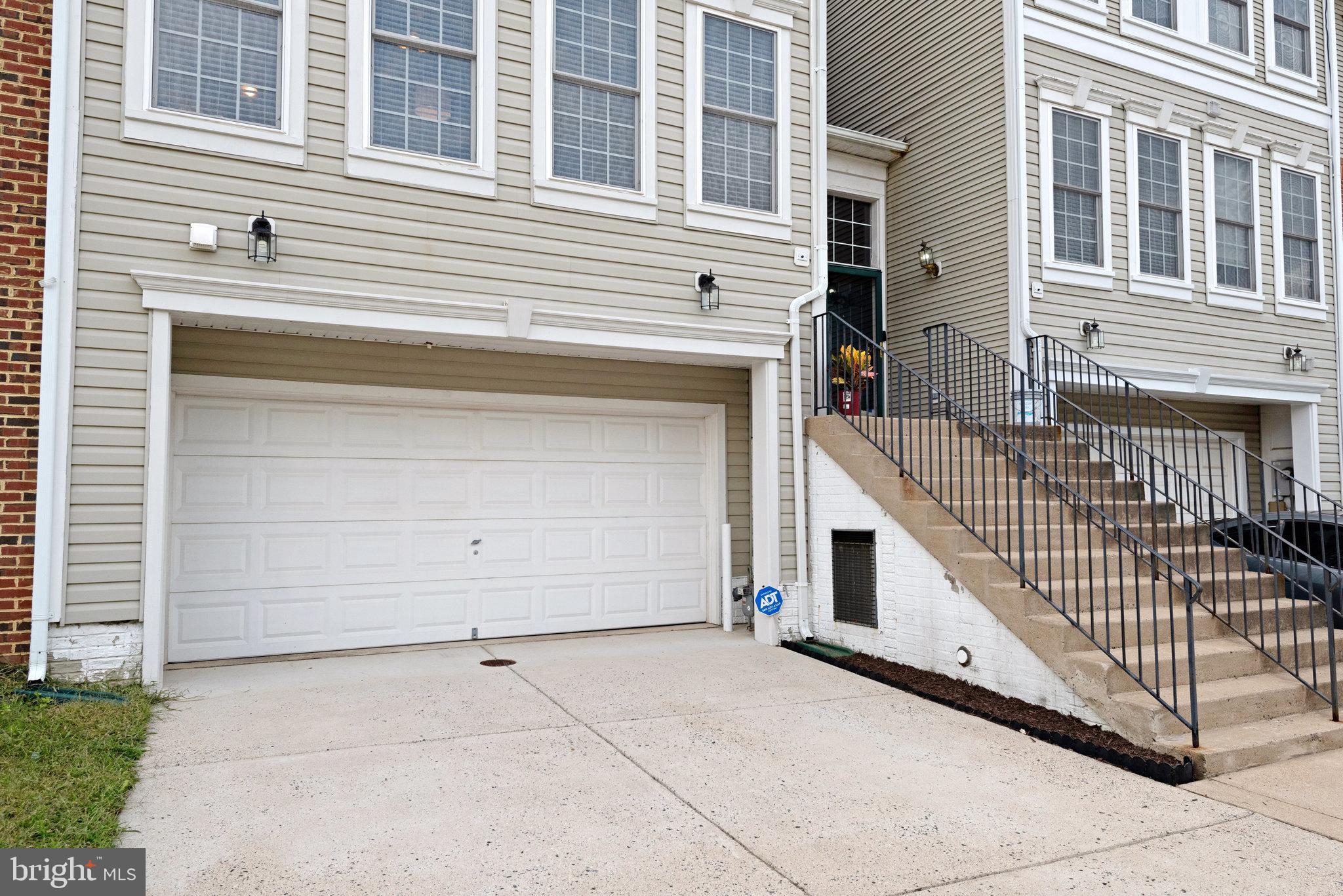 13017 Bath Gate Way Bristow, VA 20136 - Photo 4 of 35 a view of a house with a garage