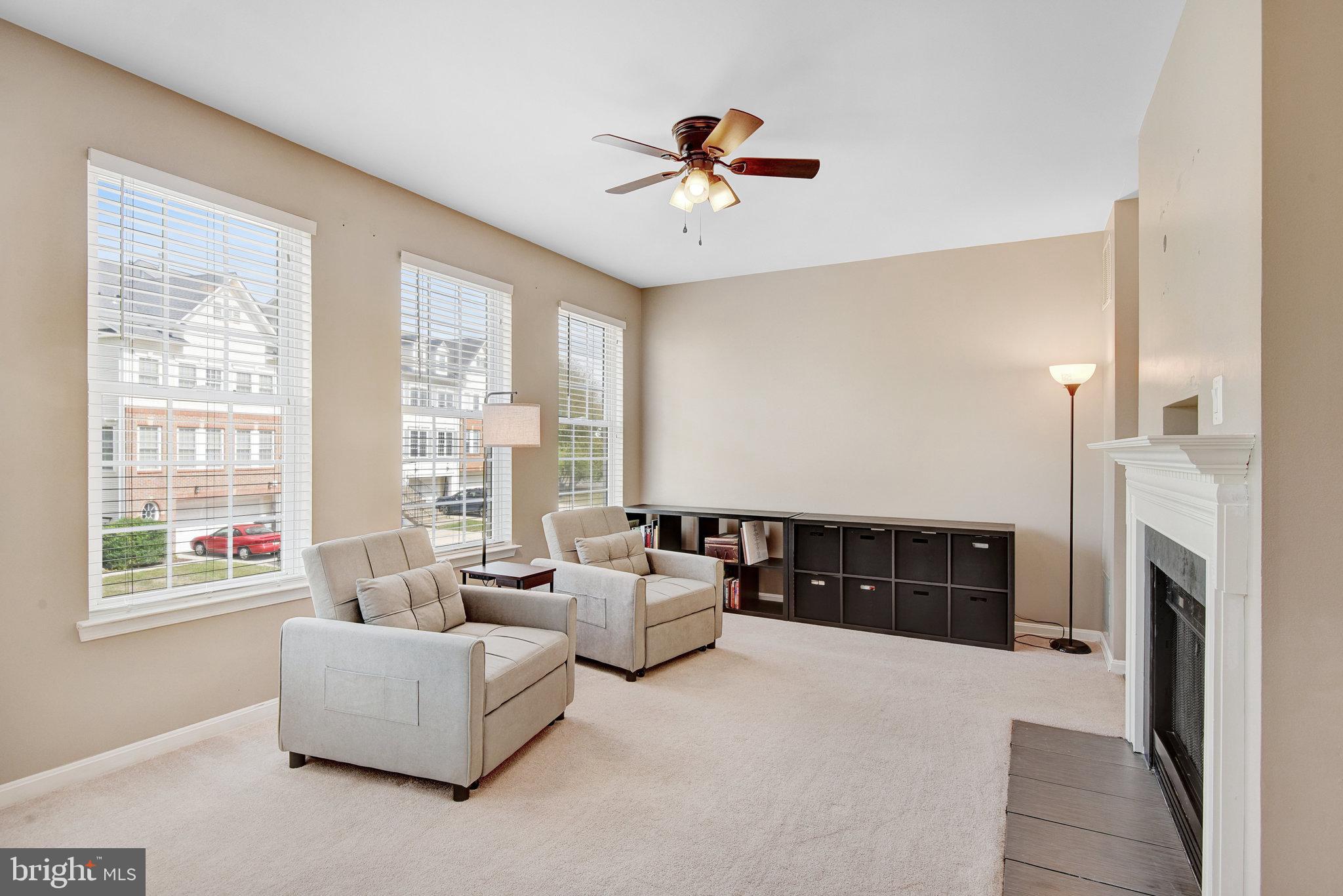 13017 Bath Gate Way Bristow, VA 20136 - Photo 7 of 35 a living room with furniture and a fireplace