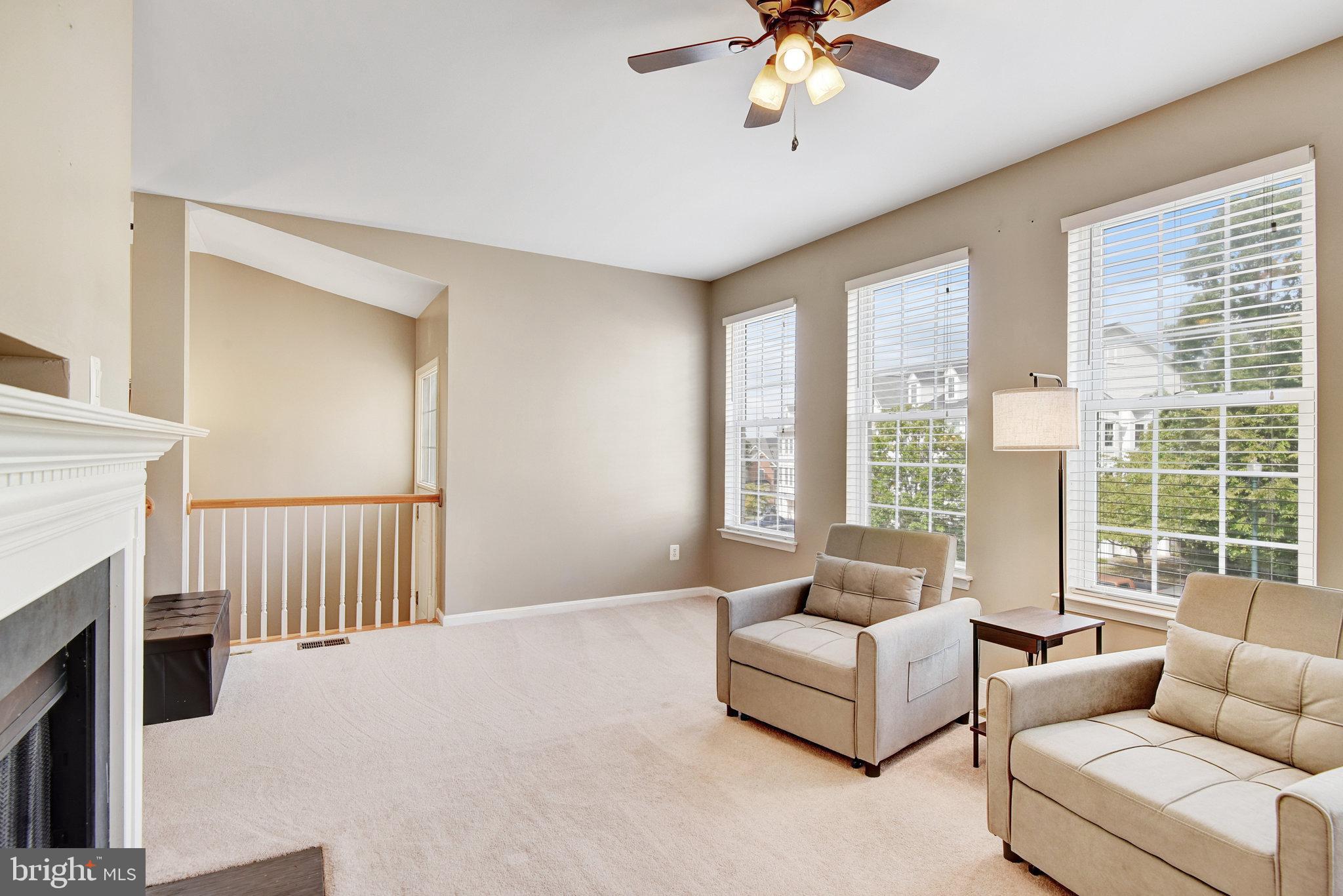 13017 Bath Gate Way Bristow, VA 20136 - Photo 9 of 35 a living room with furniture and a large window