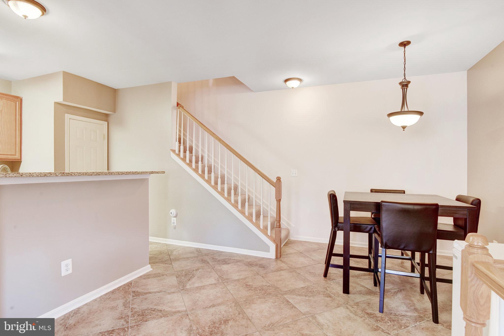 13017 Bath Gate Way Bristow, VA 20136 - Photo 10 of 35 a view of a dining room with furniture