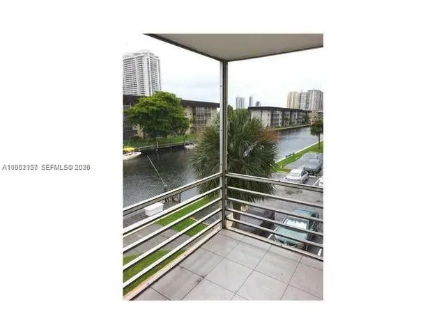 a view of a swimming pool with a yard