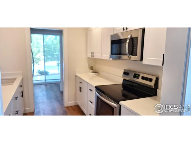 a kitchen with a stove and a microwave