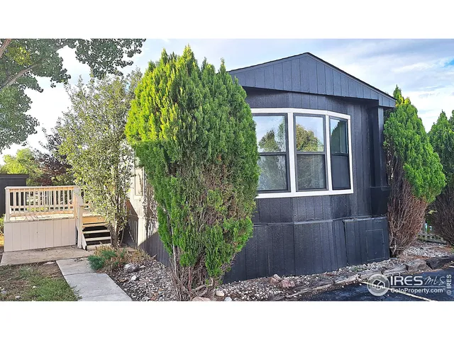 a view of house with backyard and garden