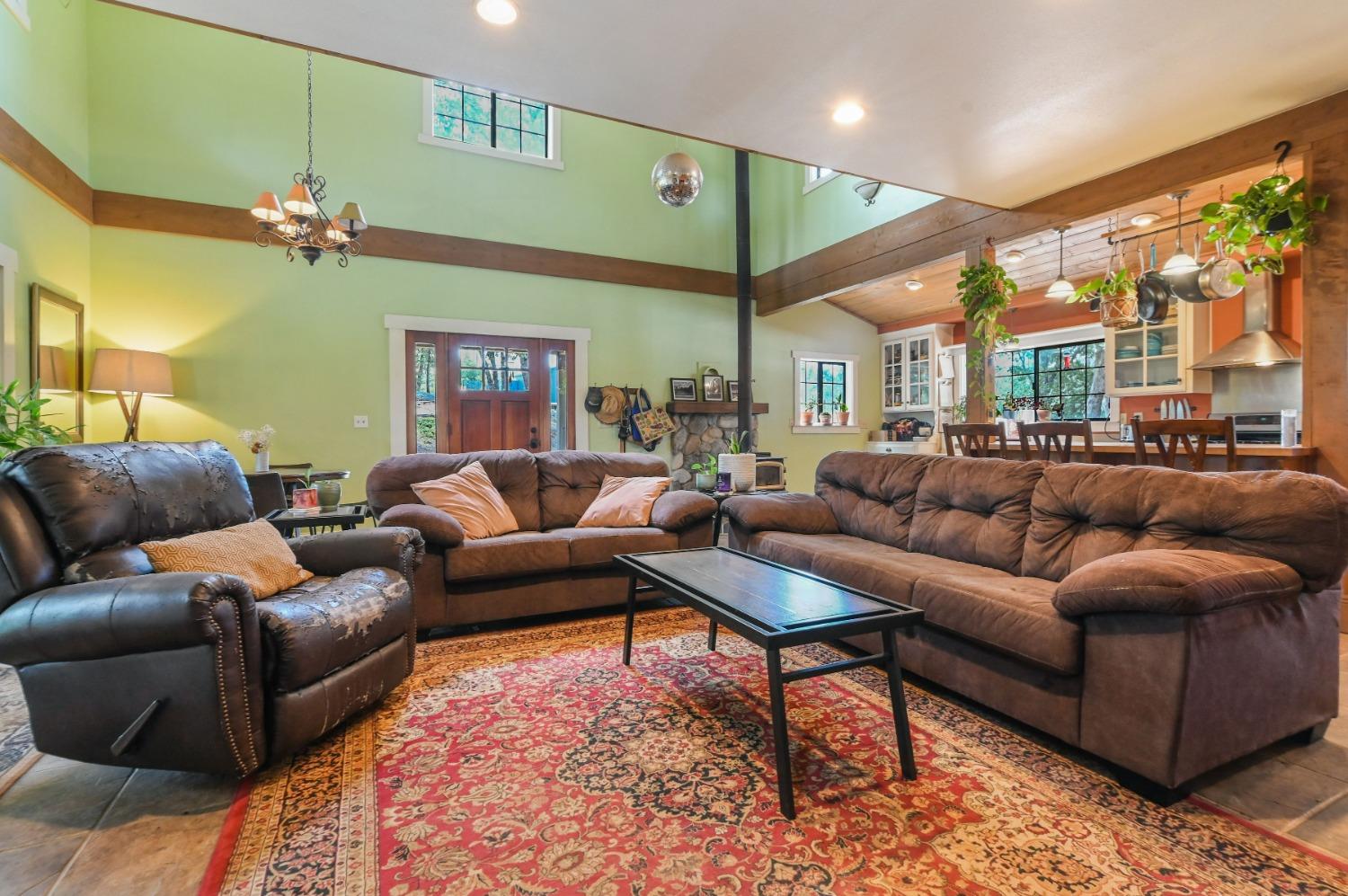 6640 Railroad Flat Road Mountain Ranch, CA 95246 - Photo 11 of 60 a living room with furniture and a large window