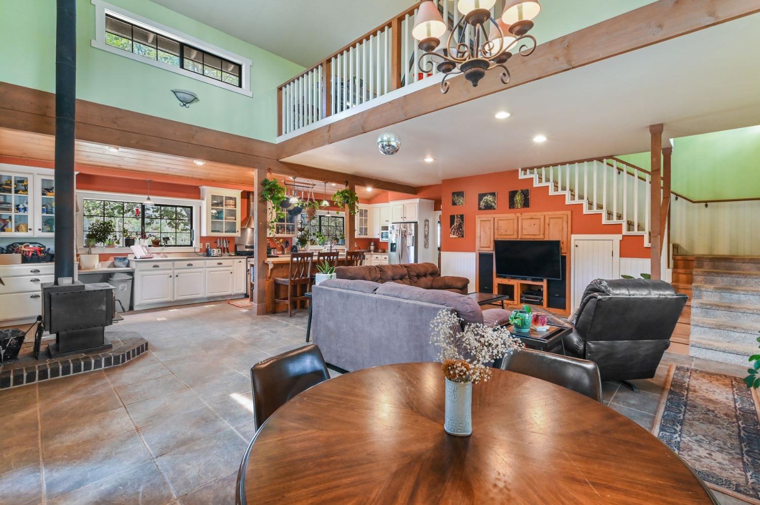 6640 Railroad Flat Road Mountain Ranch, CA 95246 - Photo 13 of 60 a living room with furniture and a fireplace