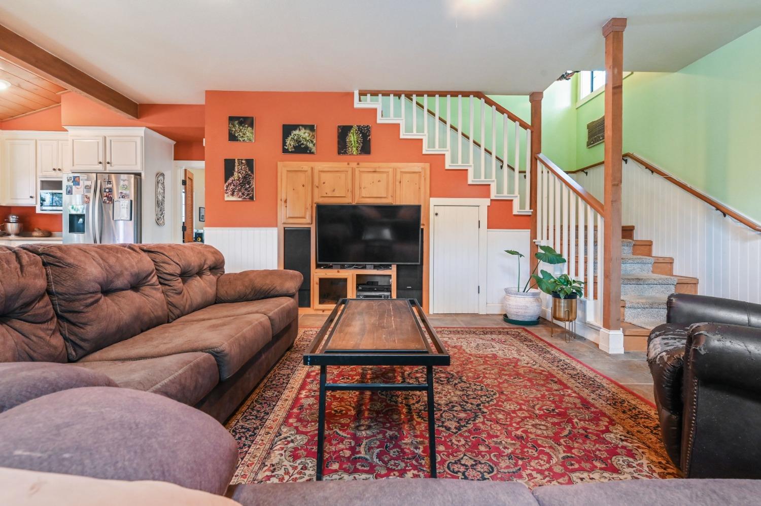 6640 Railroad Flat Road Mountain Ranch, CA 95246 - Photo 14 of 60 a living room with furniture and a fireplace