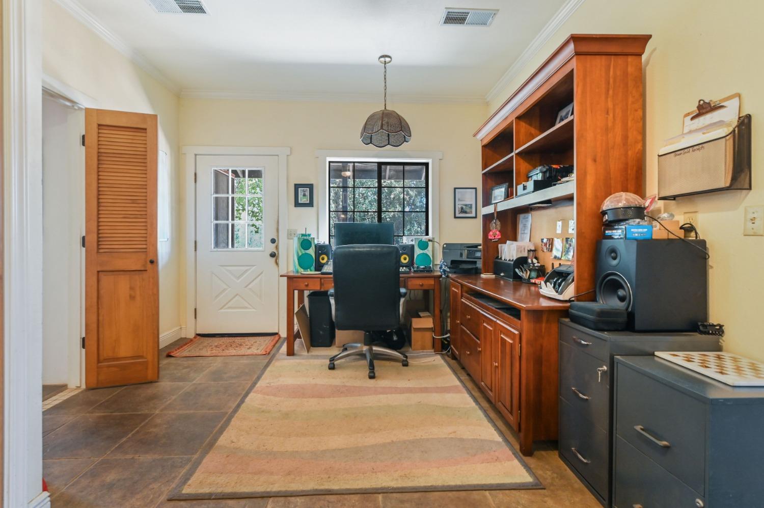 6640 Railroad Flat Road Mountain Ranch, CA 95246 - Photo 15 of 60 a dining room with furniture and a window