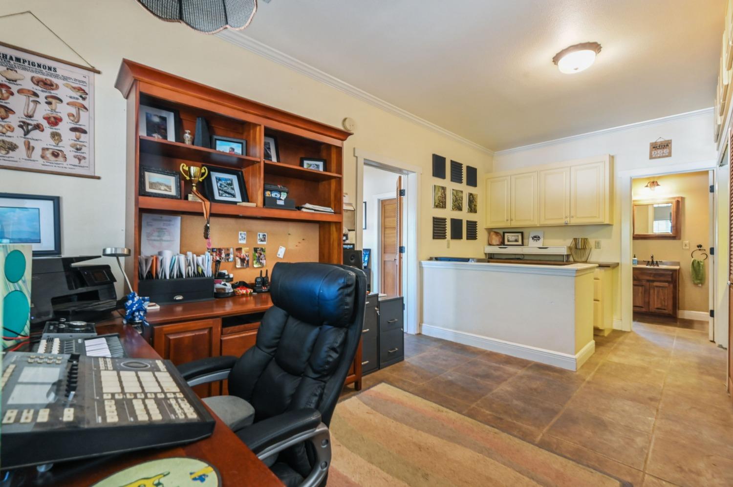 6640 Railroad Flat Road Mountain Ranch, CA 95246 - Photo 16 of 60 a view of a workspace with furniture and toys