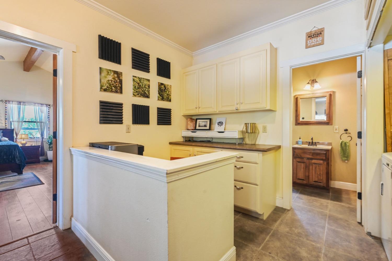 6640 Railroad Flat Road Mountain Ranch, CA 95246 - Photo 17 of 60 a kitchen with a sink stove and cabinets