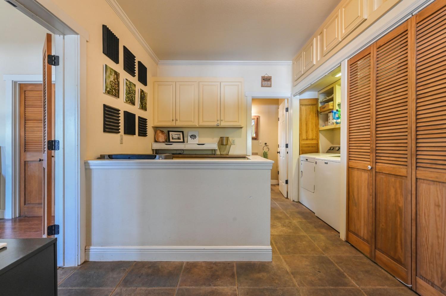 6640 Railroad Flat Road Mountain Ranch, CA 95246 - Photo 18 of 60 a kitchen with stainless steel appliances granite countertop a refrigerator a sink and dishwasher