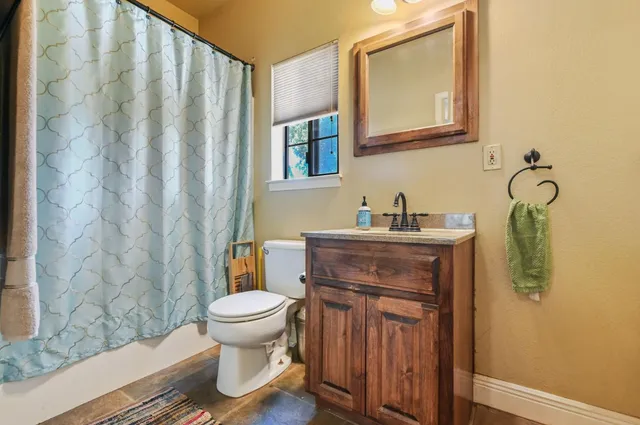 a bedroom with furniture and a window