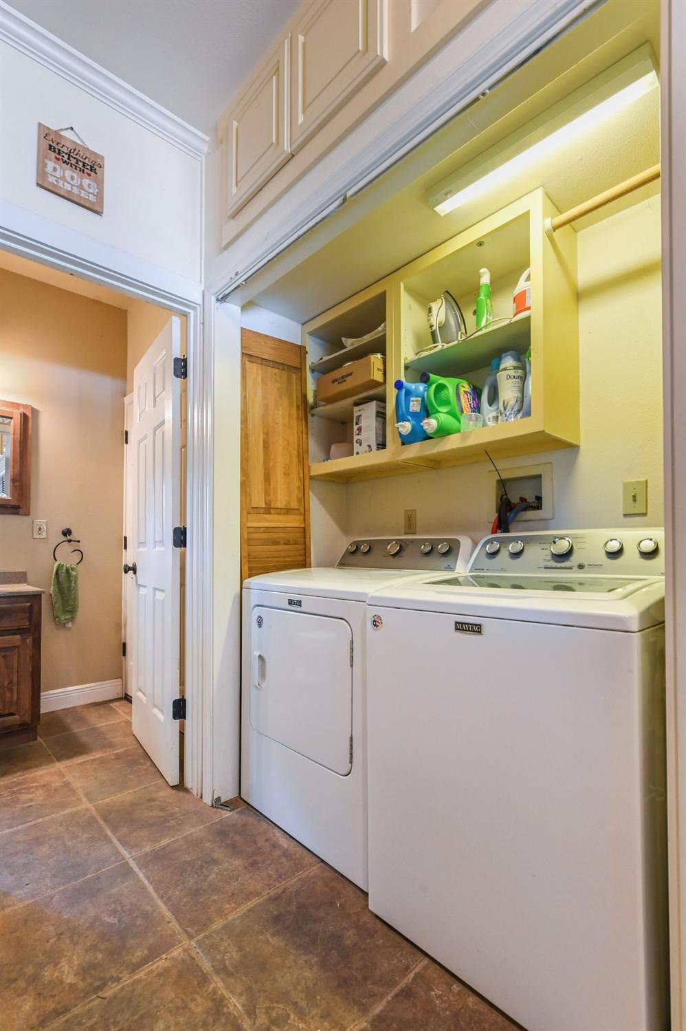 6640 Railroad Flat Road Mountain Ranch, CA 95246 - Photo 28 of 60 a bathroom with a granite countertop sink and a mirror