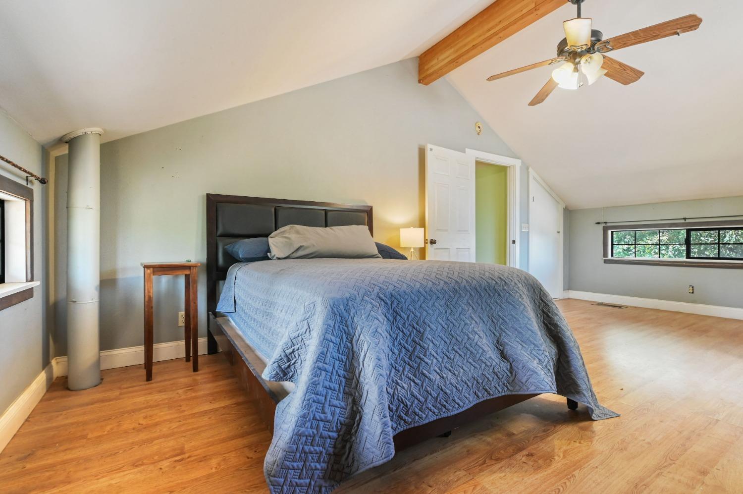 6640 Railroad Flat Road Mountain Ranch, CA 95246 - Photo 32 of 60 a bedroom with a bed and a window