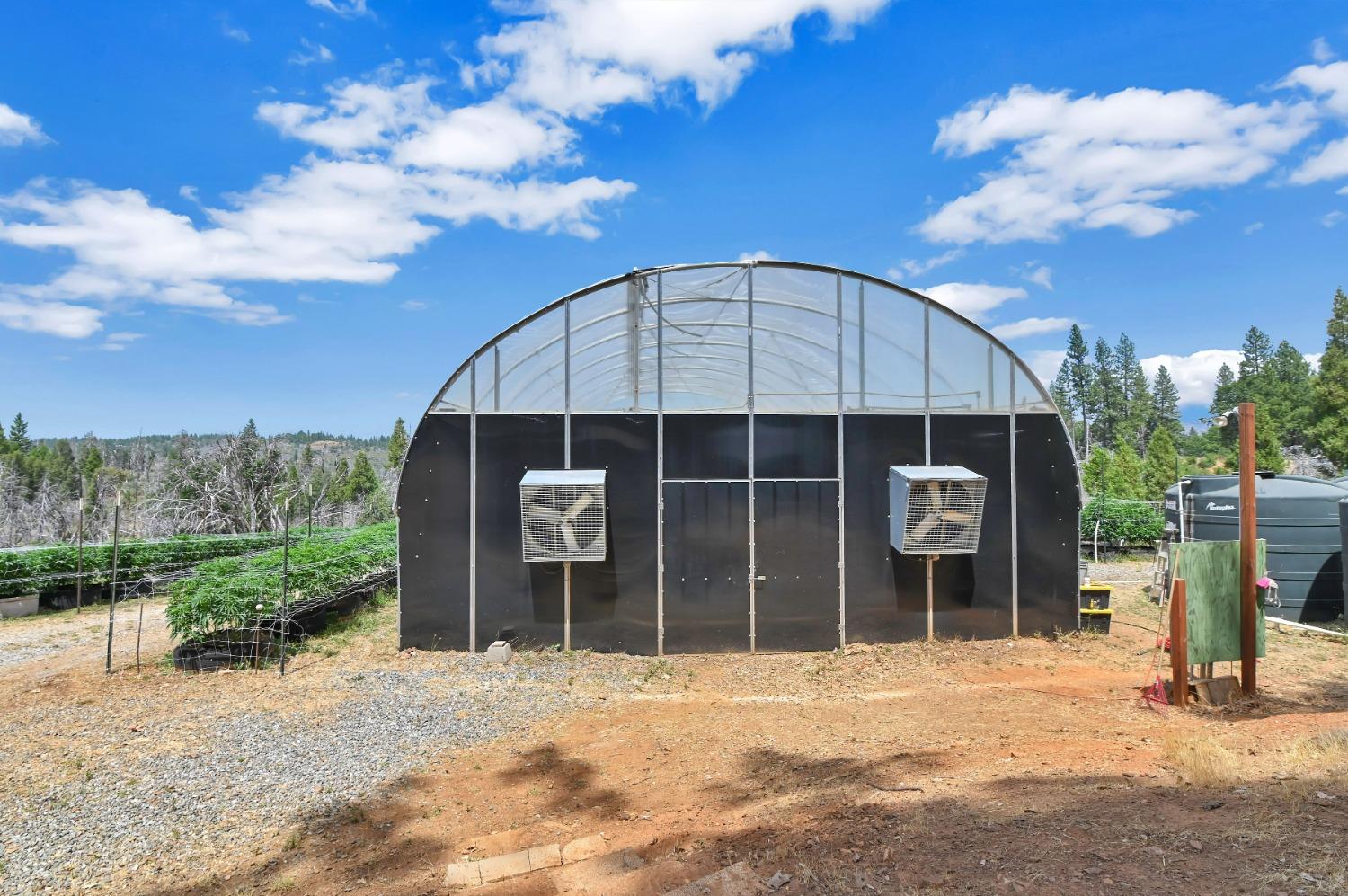 6640 Railroad Flat Road Mountain Ranch, CA 95246 - Photo 41 of 60 a front view of a house with a yard and garage