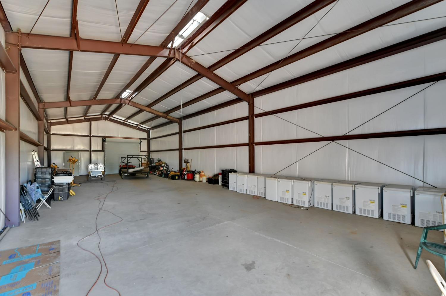6640 Railroad Flat Road Mountain Ranch, CA 95246 - Photo 49 of 60 a view of an empty room with a lot of stuff