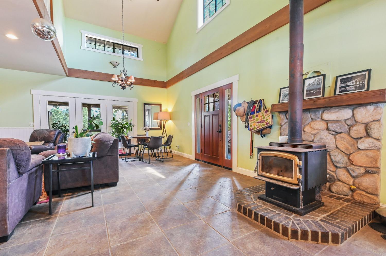 6640 Railroad Flat Road Mountain Ranch, CA 95246 - Photo 5 of 60 a living room with furniture and a fireplace