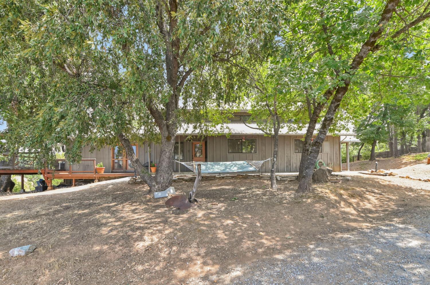 6640 Railroad Flat Road Mountain Ranch, CA 95246 - Photo 57 of 60 a backyard of a house with table and chairs