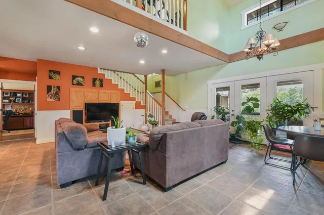 a large kitchen with lots of counter space wooden floor and appliances
