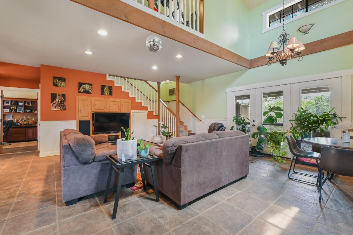 6640 Railroad Flat Road Mountain Ranch, CA 95246 - Photo 6 of 60 a living room with furniture and a flat screen tv