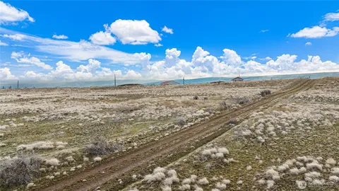 a view of a sitting in middle of the ocean
