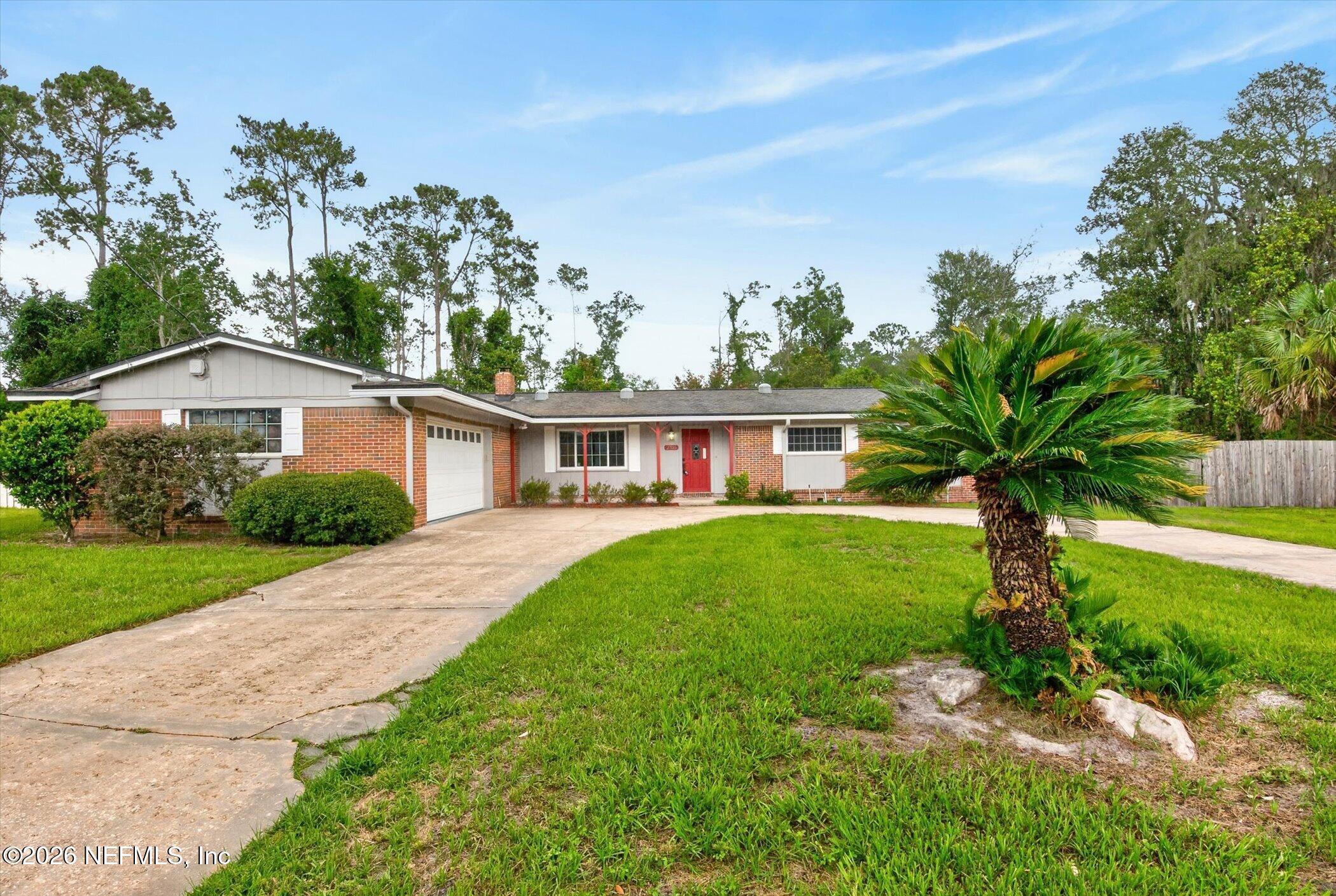 2705 Navajo Road Orange Park, FL 32073 - Photo 4 of 58 a front view of a house with a yard
