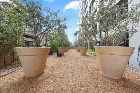 a view of a building with a bench next to a road